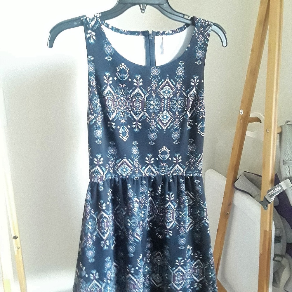 Sleeveless, black patterned dress